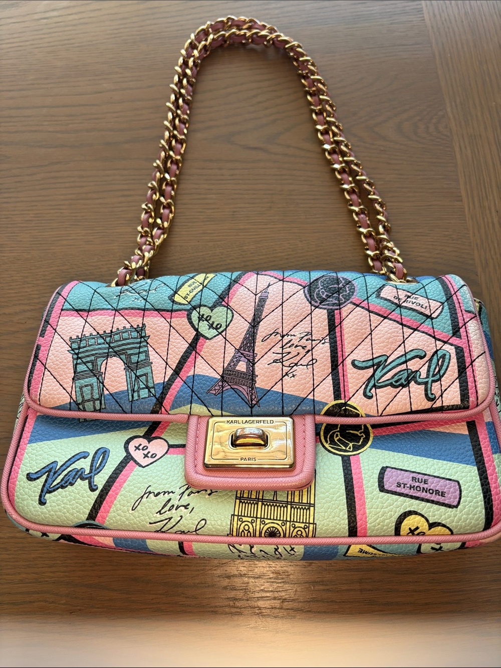 KARL LAGERFELD OF PARIS ICONIC PARIS DESIGN W/ GOLD ADJUSTABLE CHAIN STRAP